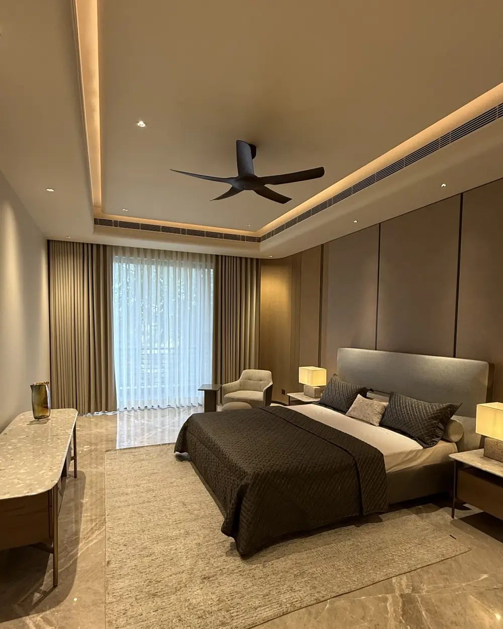 Bedroom with bedside lighting in a luxury builder floor in Gurgaon