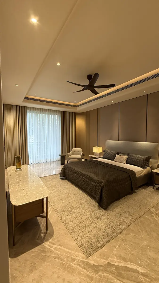 Principal bedroom with a window wall in a premium builder floor in Gurgaon