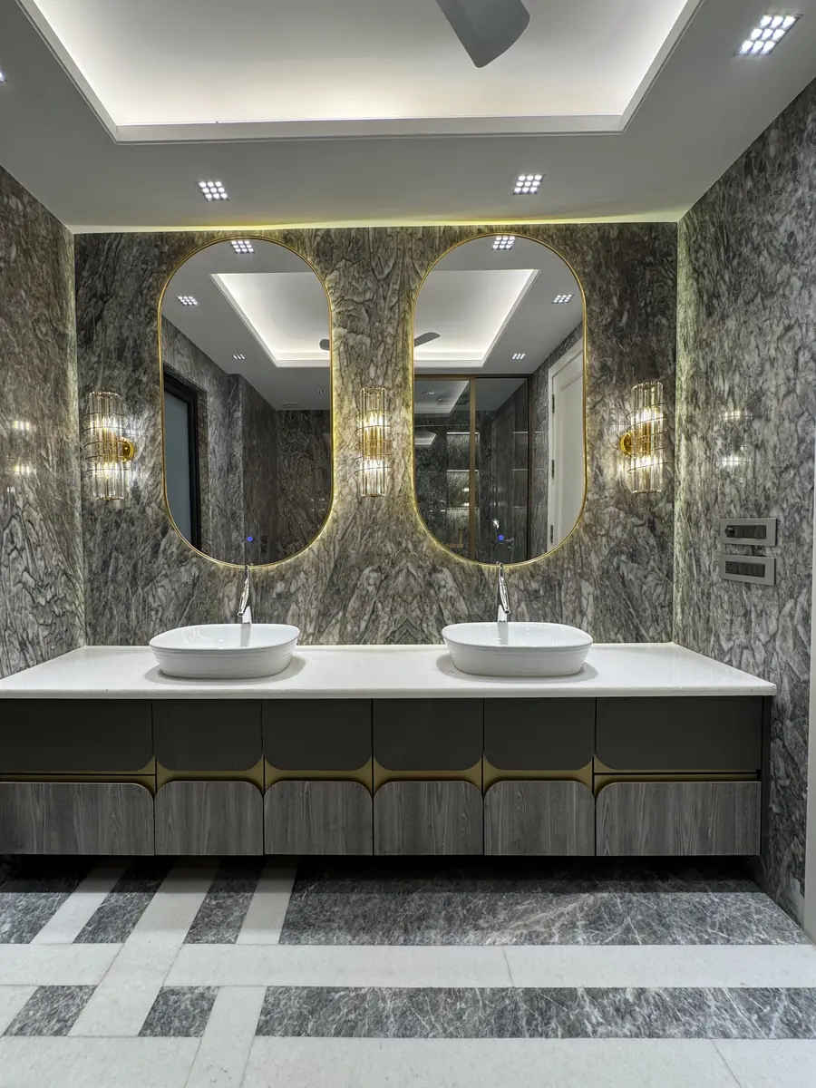 Marble bathroom with twin vanities in a luxury builder floor in Gurgaon