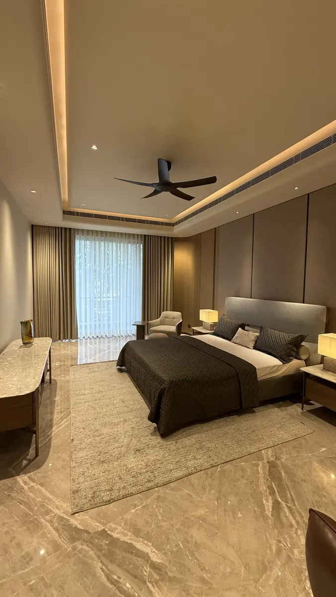 Bedroom with bedside lighting in a luxury builder floor in Gurgaon