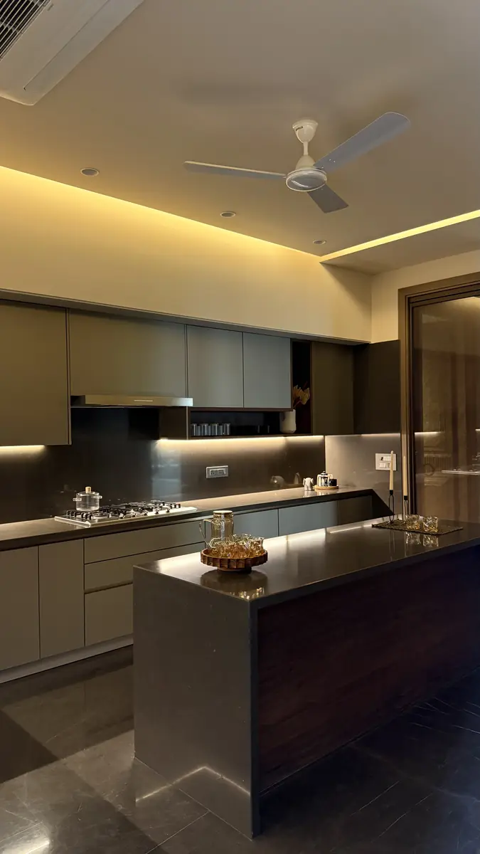 Kitchen island and stone counter in a Gurgaon builder floor