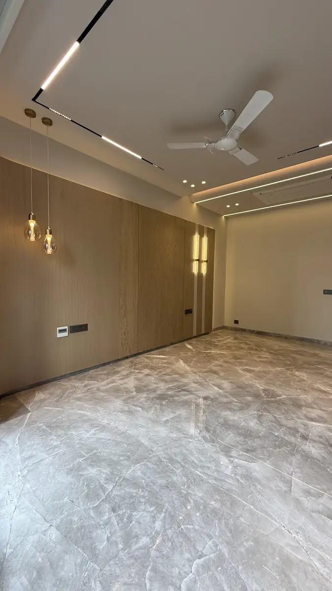 Unfurnished reception room with timber panelling in a builder floor in Gurgaon