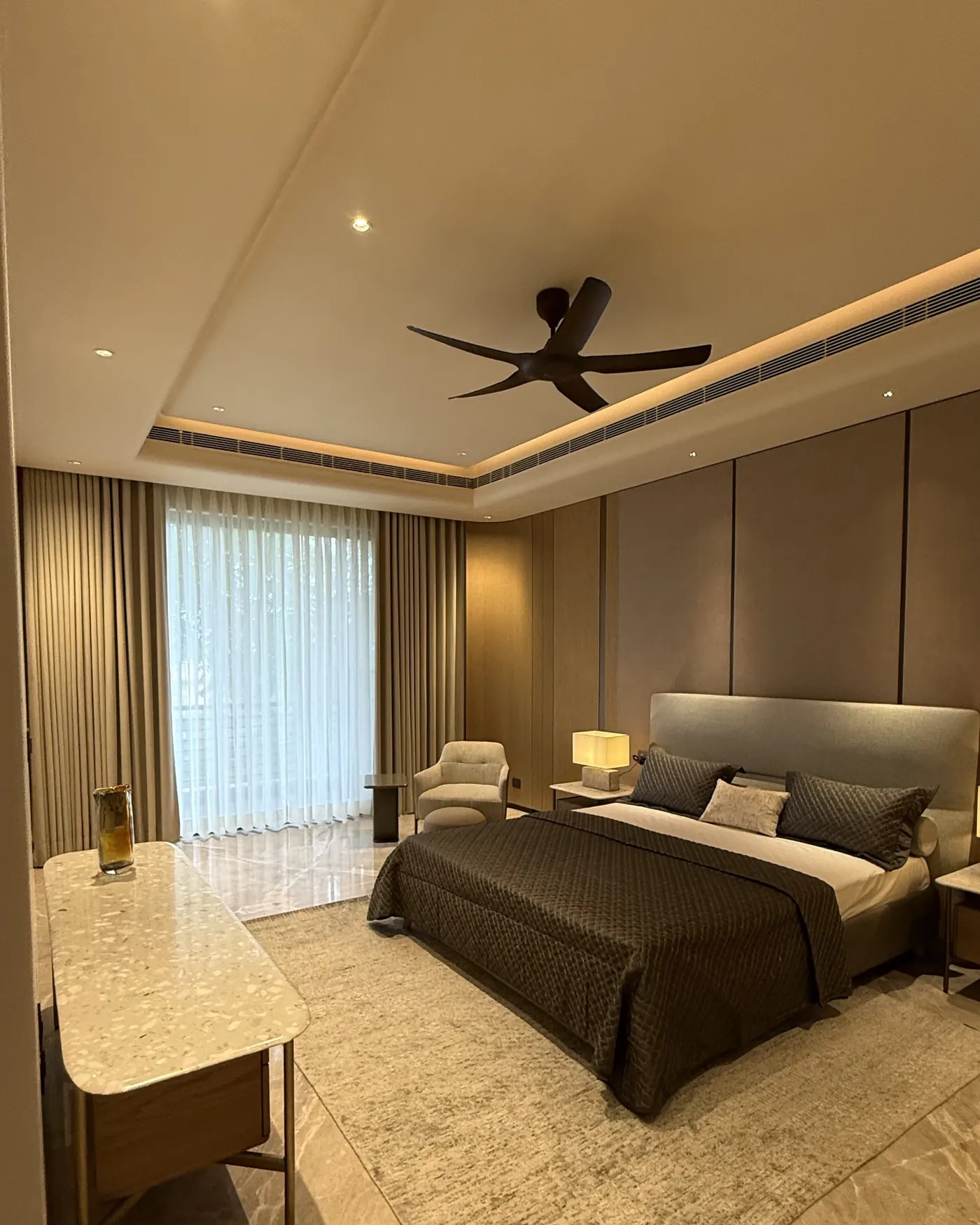 Luxury builder floor bedroom in Gurgaon with a full window wall