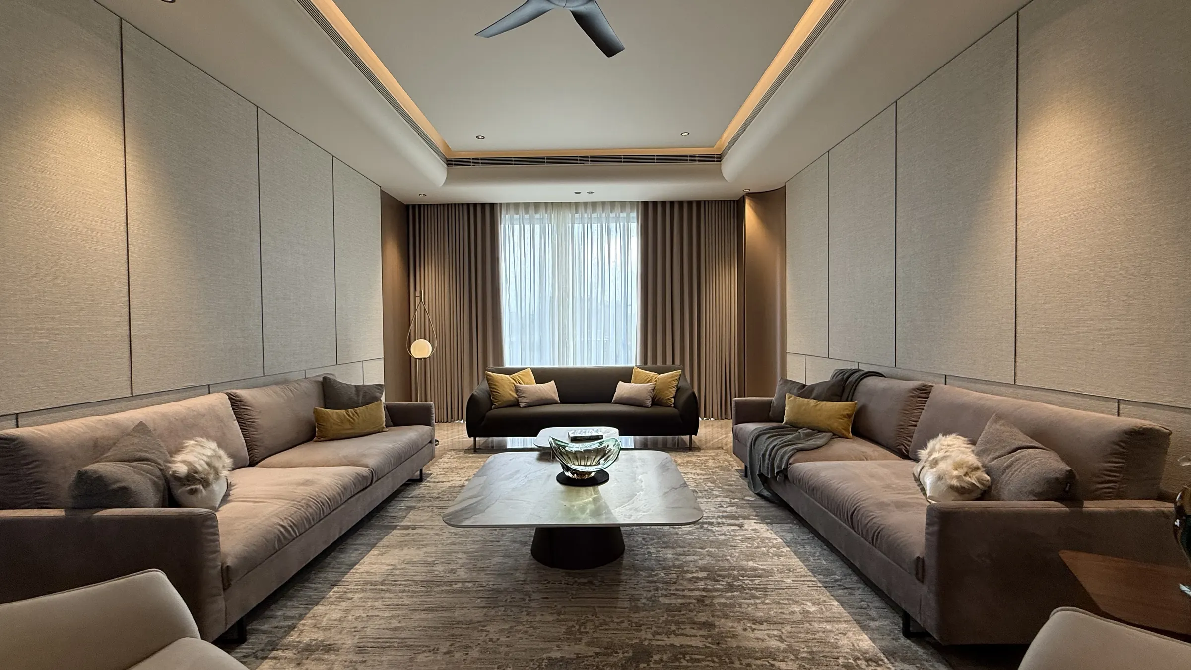 Premium Gurgaon builder floor living room with panelled walls and a recessed ceiling