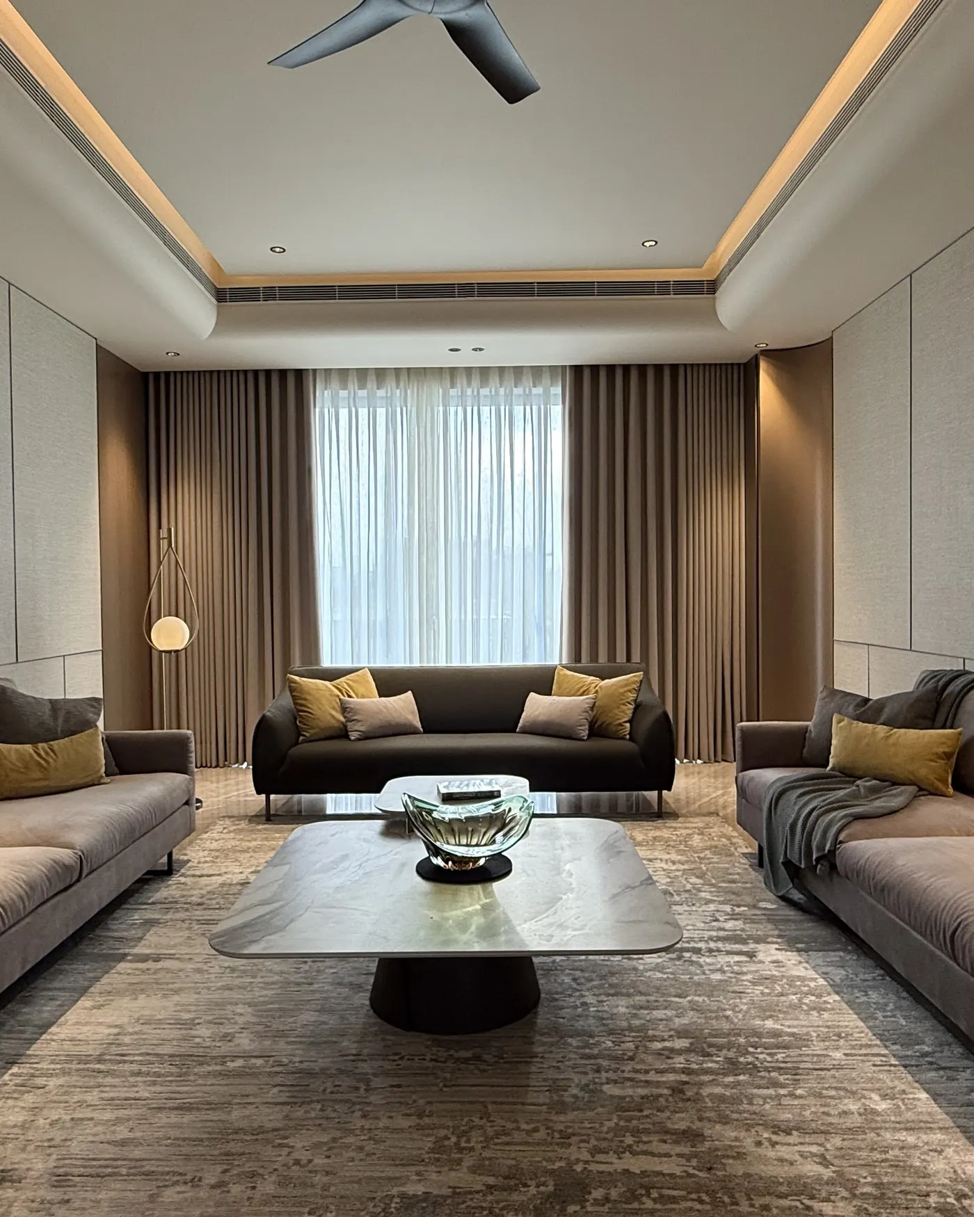 Living room with panelled walls in a premium builder floor in Gurgaon